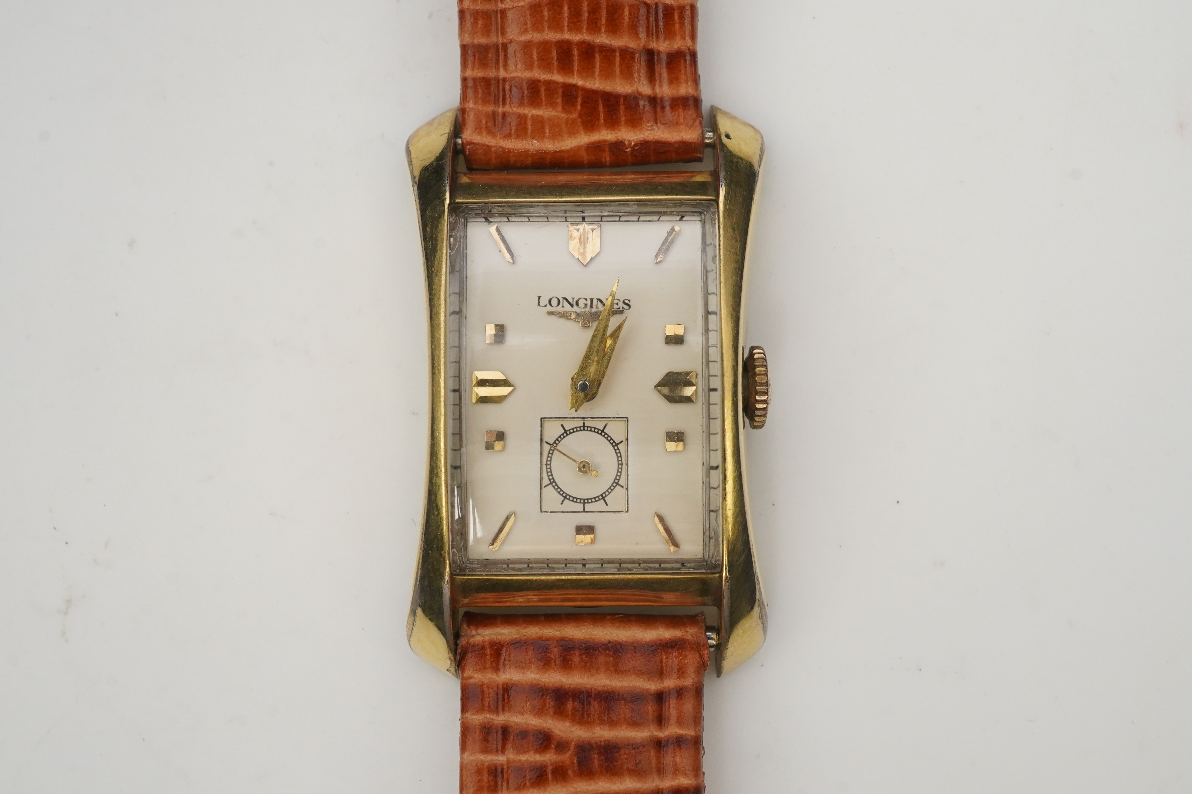 A gentleman's 1950's 10k gold filled Longines manual wind wrist watch, on a later associated leather strap